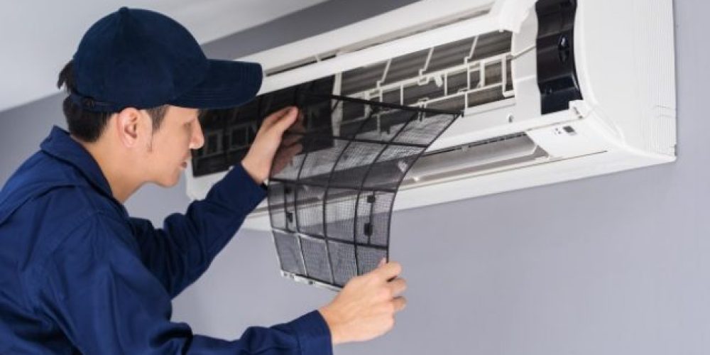 technician-service-removing-air-filter-air-conditioner-cleaning_35076-3617-640x426